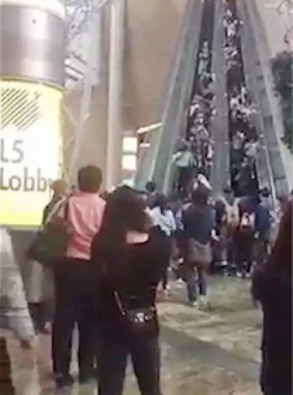 Watch the moment an Escalator malfunctions and starts running backwards, leaving 18 injured in a Hong Kong Mall